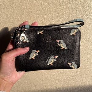 Gently used (2 times) adorable black wristlet with charms.